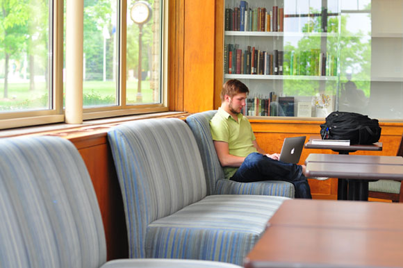 Image of a student studying in the coffee shop.