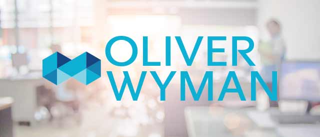 blurry business background with Oliver Wyman logo