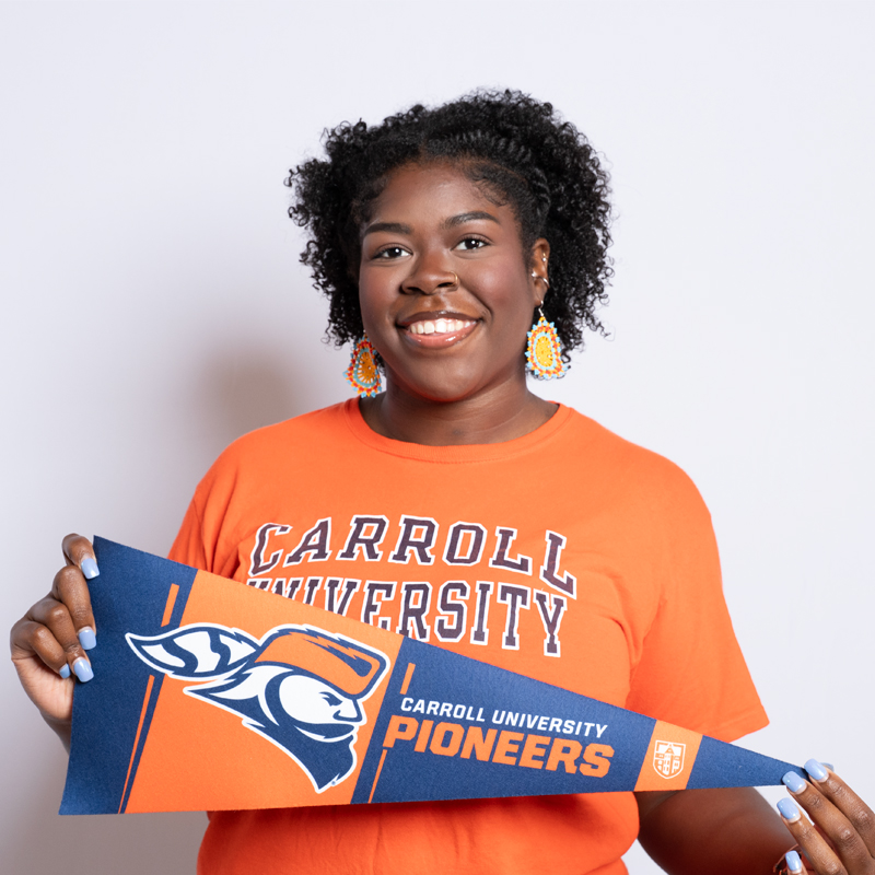 Women wearing a Carroll University shirt.
