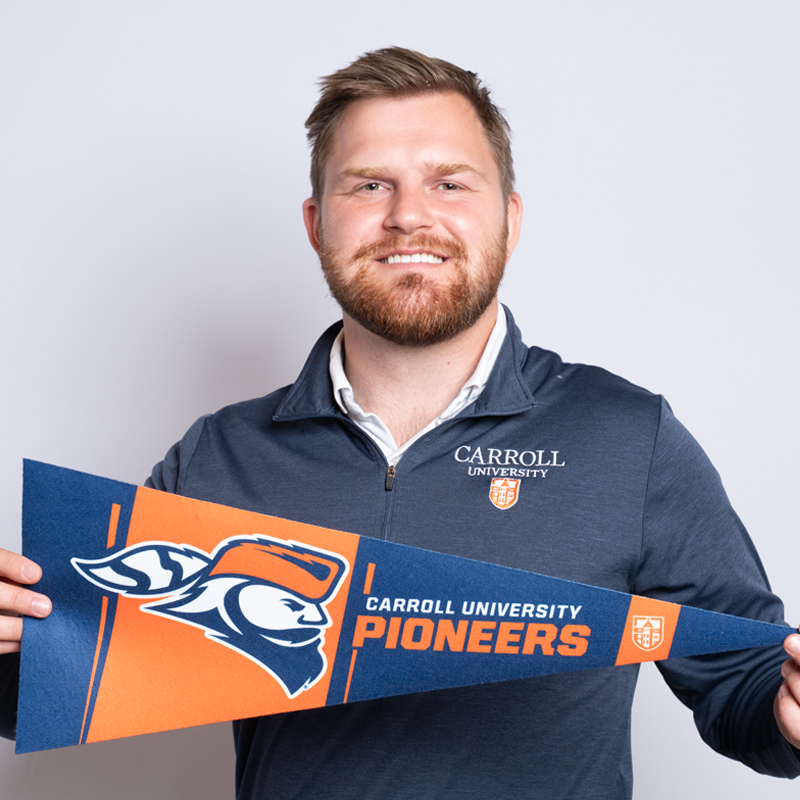 Man in Carroll quarter zip.