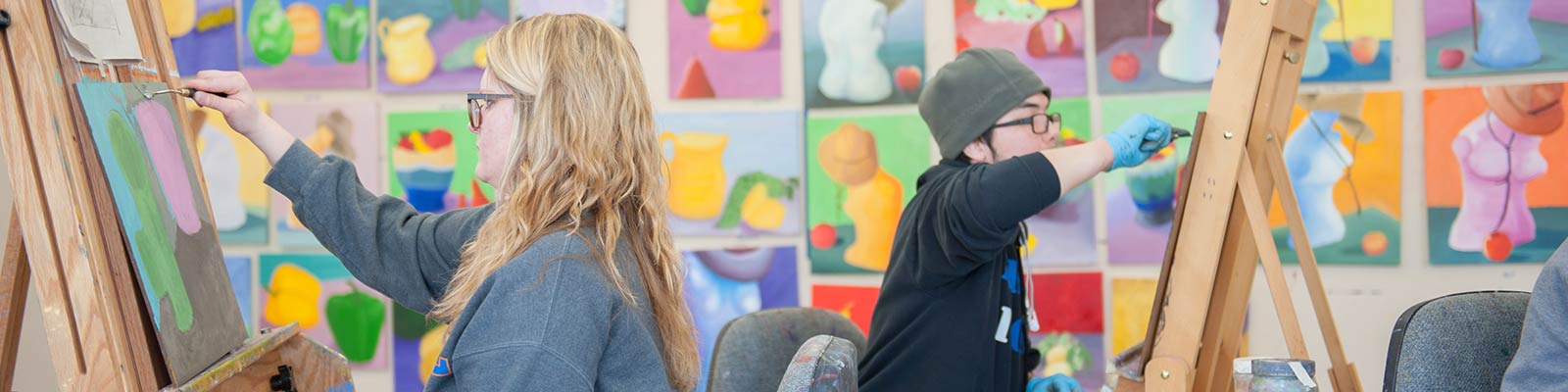 students painting in art studio