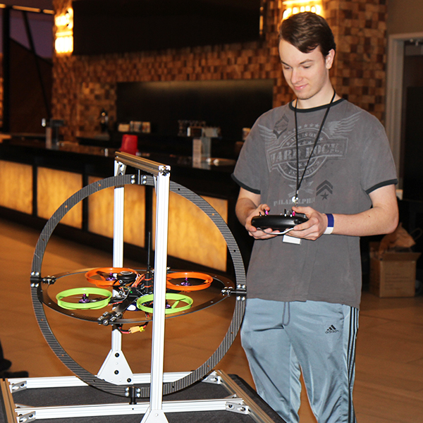 student with remote control for dron