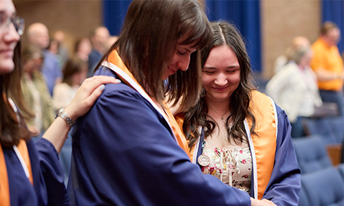 A group of graduates in gowns.