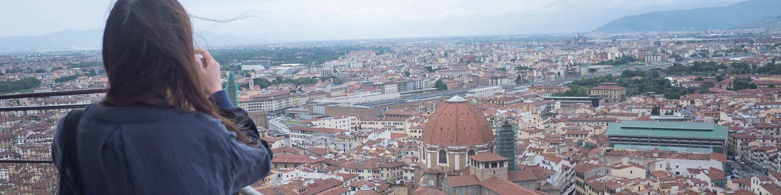 student taking photo of city