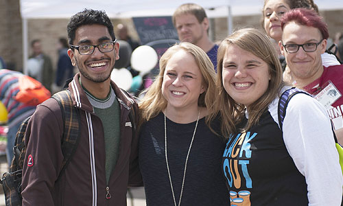 Students smiling at an outdoor event