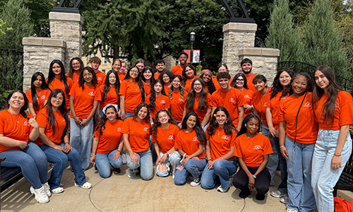 Group of students wearing orange.