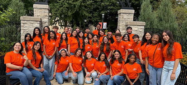 Students gathered together wearing orange.