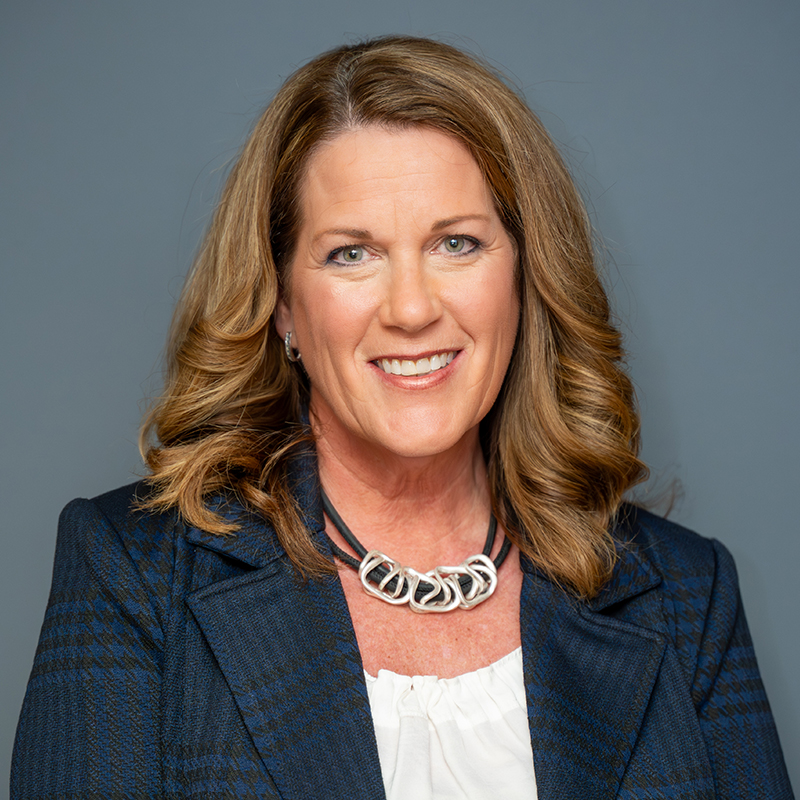 Women wearing a blue blazer.