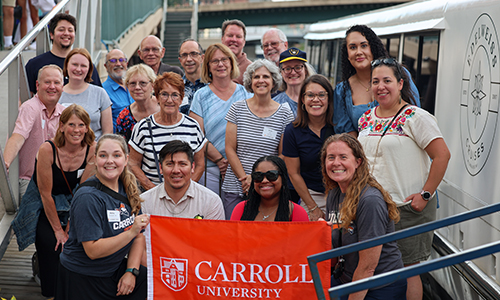 Group of Alumni with Carroll Flag.