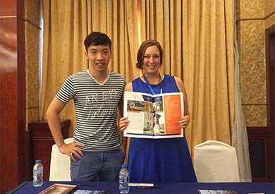 Duy Nguyen standing with Megan Couch, Carroll University International Student Coordinator