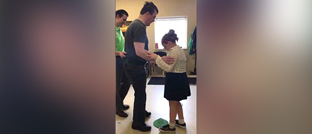 Brian Baker Dancing with His Daughter at Carroll's Therapeutic Abilities Clinic