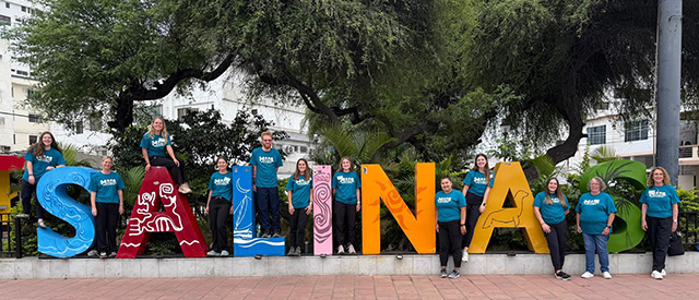 Carroll DPT students and faculty picture by Salina sign