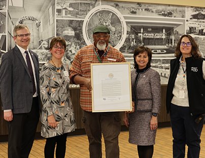 Carroll President Cindy Gnadinger holds Zoo proclamation with Carroll and zoo staff