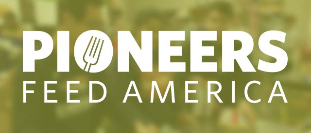 Voluteers at a food bank with the Pioneers Feed America logo 