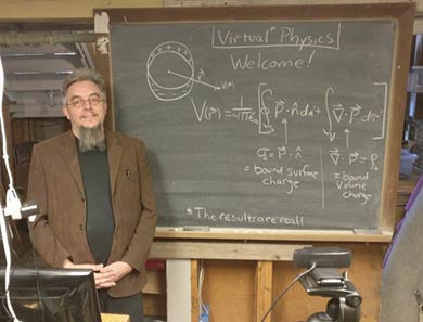 Dr. Tate Wilson standing near a chalkboard