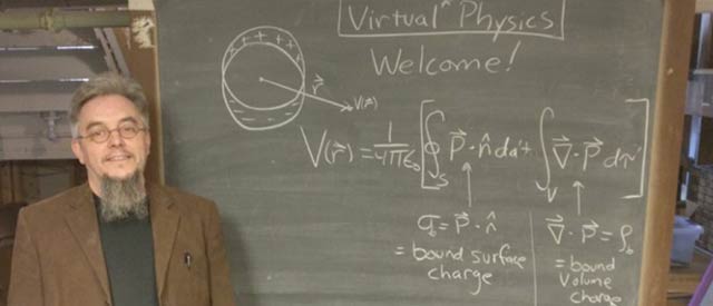 Dr. Tate Wilson standing near a chalkboard