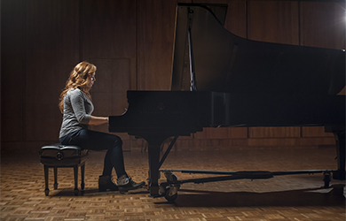 Young woman playing the piano