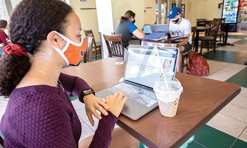 diverse student studying in Stone Creek Coffee