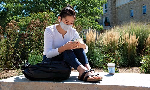 student sitting outside
