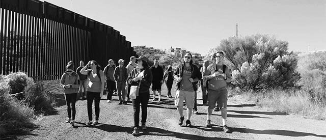 students walking along a border