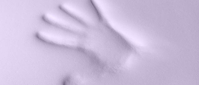 The indentation of a hand left on memory foam