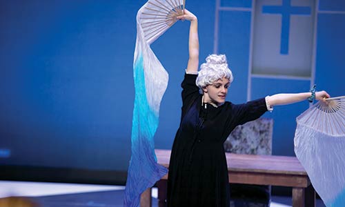 student actress performing in a dress rehearsal of "Tartuffe"