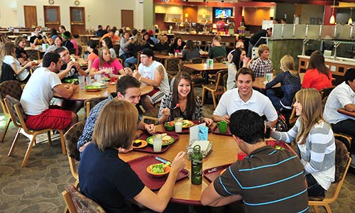 large groups of male and female students having lunch in the Campus Center's Main Dining Hall
