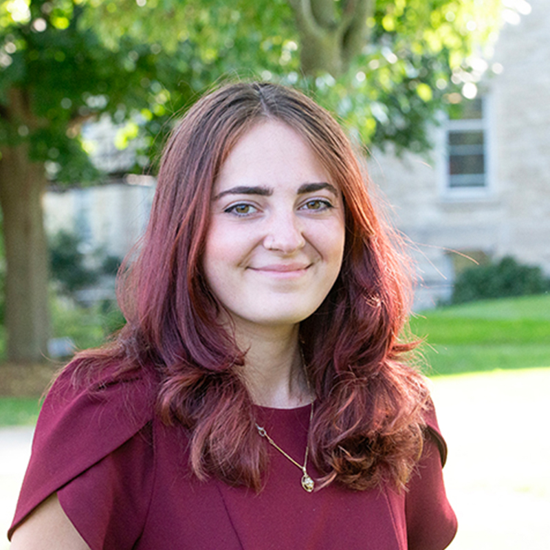 Women in maroon shirt.