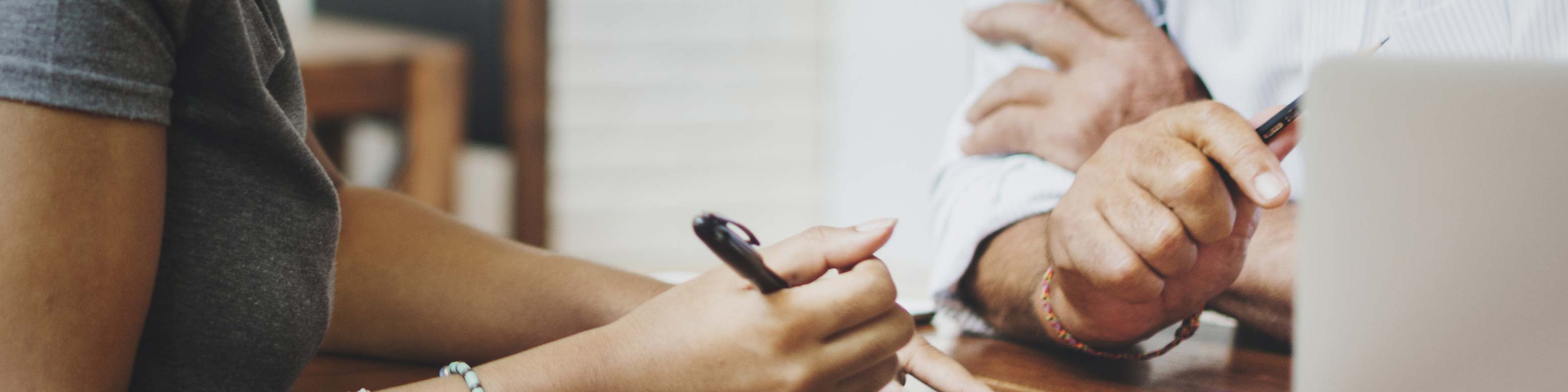 hand writing something with a pen