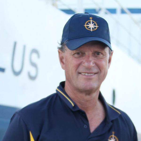 Robert Ballard standing next to the nautilus boat