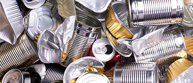 a pile of aluminum cans and lids. 