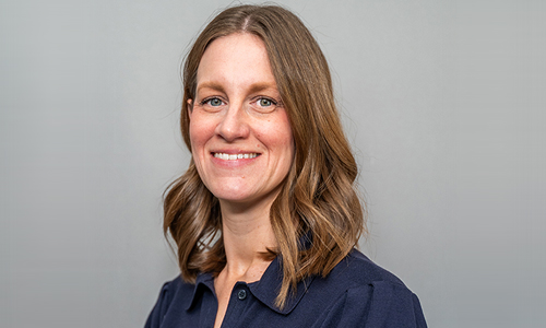 Smiling face with kind eyes in warm lit room