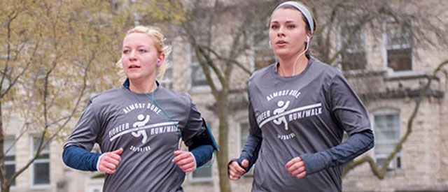 Participants running a 5K on the Carroll University campus