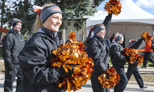 members of the cheerleading team with pompoms