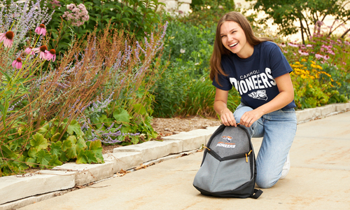 A student on campus with Carroll gear